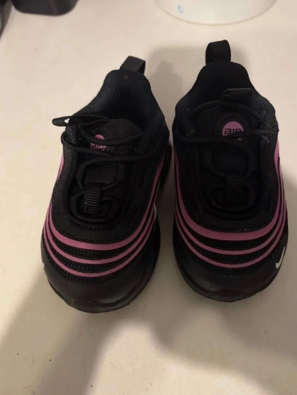 Nike Kids Black Sneakers with Pink Swoosh Accents